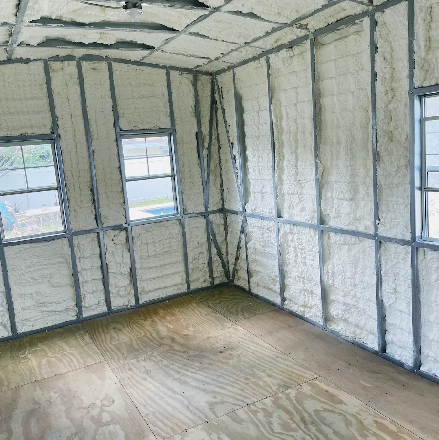 Closed-cell spray foam insulation applied to wall cavities in a residential project in Phelan